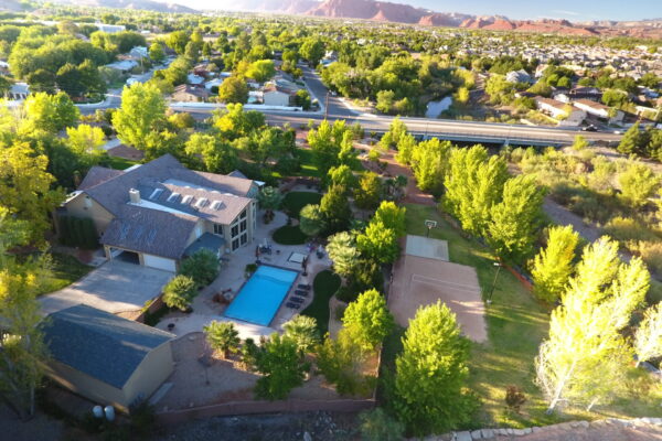 Aerial view of the St. George River Home vacation rental with private pool and basketball court